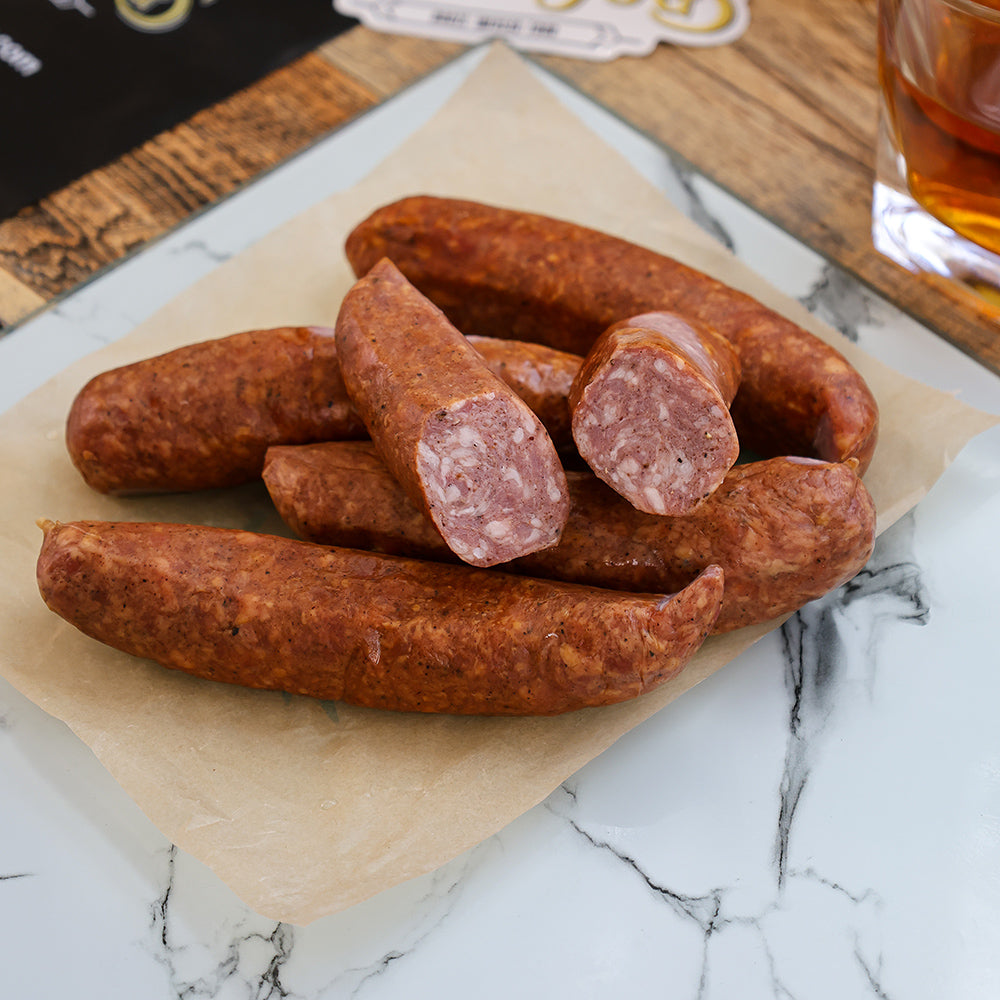 CUT LINKS OF RUM INFUSED SAUSAGE