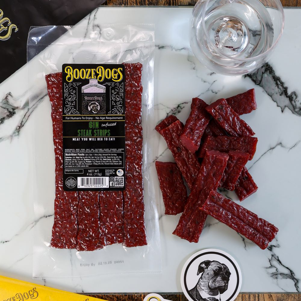 4 OZ PACK OF GIN INFUSED JERKY STYLE STEAK STRIPS WITH CUT PIECES TO THE SIDE