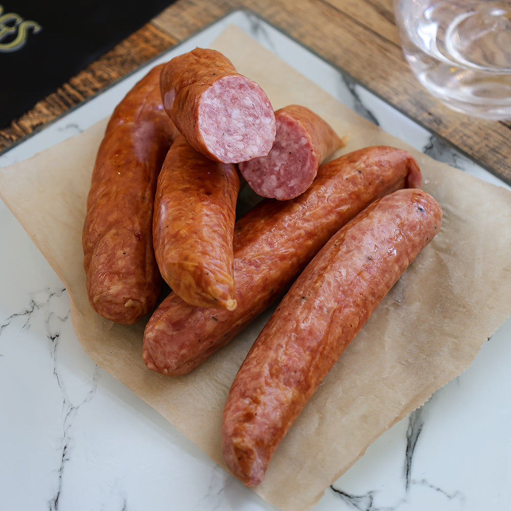 CUT LINKS OF GIN INFUSED SAUSAGE